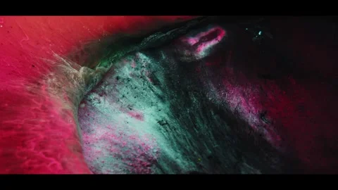 Close-up of glowing abstract liquid swirl in vibrant red. Macro fluid art motion Stock Footage 340450331