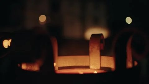 Close-up of a glowing brazier with flickering flames against a dark, Stock Footage 283063908