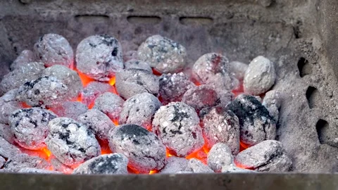 Close up of glowing burning coals and flames in barbecue grill Stock Footage 284251293