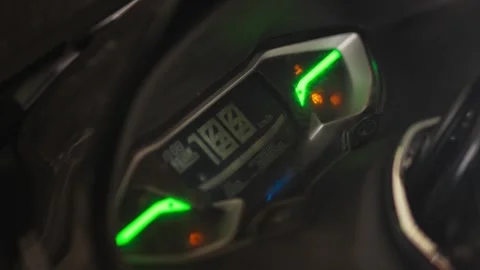 Close Up of Glowing Digital Motorcycle Speedometer Stock Footage 344235999