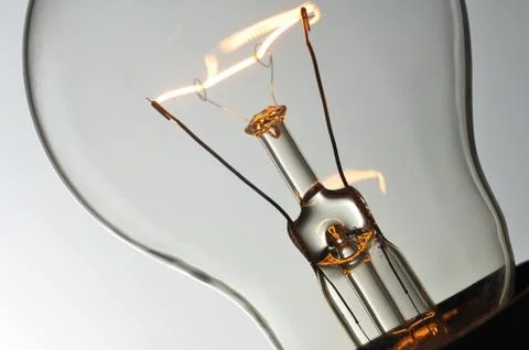 Close up glowing light bulb Stock Photos