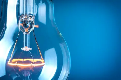 Close up glowing light bulb Stock Photos