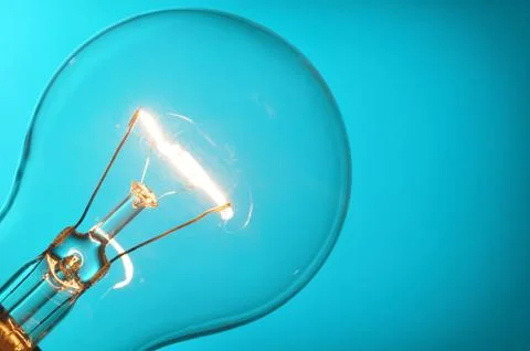 Close up glowing light bulb Stock Photos