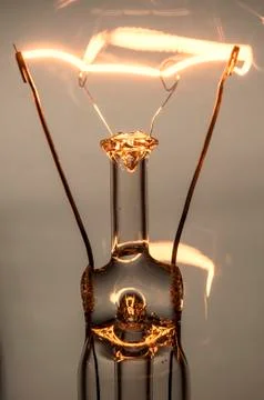 Close up glowing light bulb Stock Photos