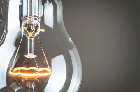 Close up glowing light bulb Stock Photos