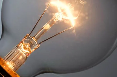 Close up glowing light bulb Stock Photos