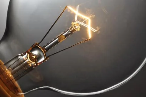 Close up glowing light bulb Stock Photos
