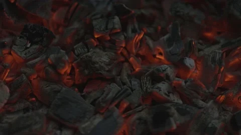 Close-up of glowing red coals in slow motion Stock Footage 159982605