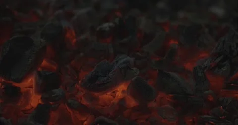 Close-up of glowing red coals in slow motion Stock Footage 159982631
