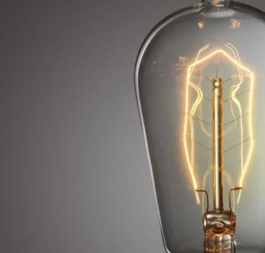 Close up glowing vintage light bulb Stock Photos