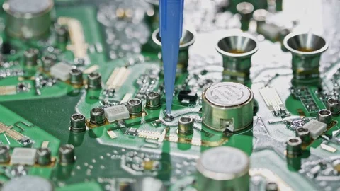 Close up of glue application on a large circuit board Stock Footage 98740964