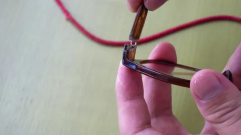 Close up gluing some glasses to fix them Video stock 149386116