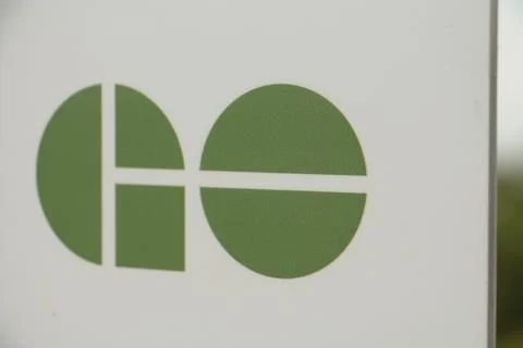 Close on go train transit mass transportation system green logo on white back Stock Photos