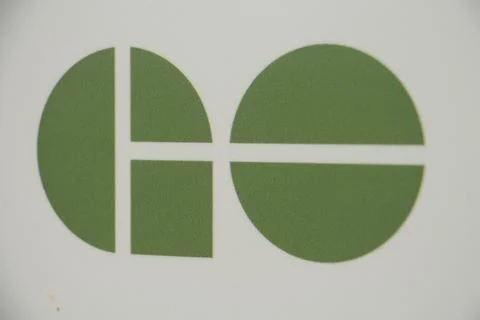 Close on go train transit mass transportation system green logo on white back Stock Photos