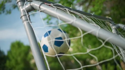 Close-Up of Goal Post as Ball is Shot into the Net, Goalkeeper Misses Stock Footage 285568048