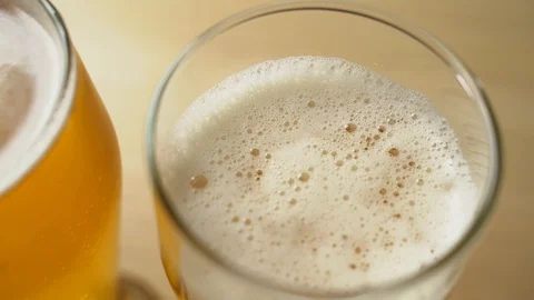 Close-up of goblets with pouring beer isolated Stock Footage 129239429