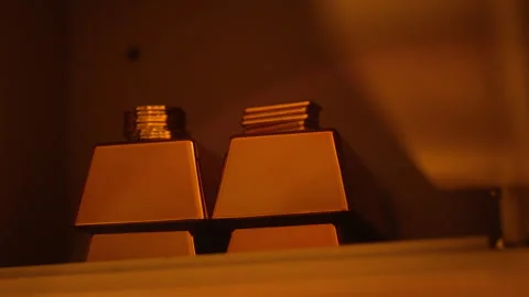 Close-Up of Gold Bars and Coins in Safe with Shallow Depth of Field Stock Footage 328371663