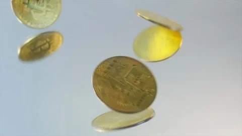 Close-up, gold Bitcoin physical coins falls on glass white table Stock Footage 267050497