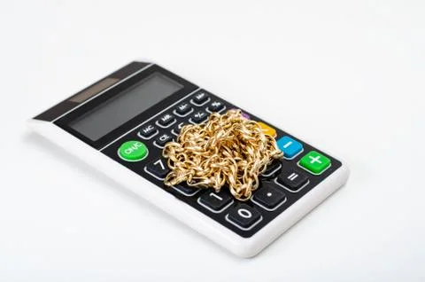Close-up of   gold chain  on a pocket computer representing concept    of  we Stock Photos