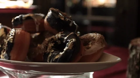 Close up gold flaked mini donuts movement Video stock 106059626