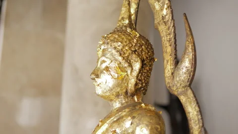 Close up of a golden Buddha statue inside a Thai temple Stock Footage 327635132