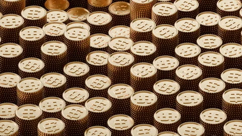 Close up of golden coin stacks symbolizing wealth and Dollar currency abundance 스톡 동영상 344409044