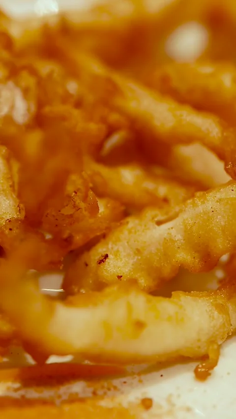 Close Up of Golden Crispy Fried Calamari with Parsley Garnish Stock Footage 329606227