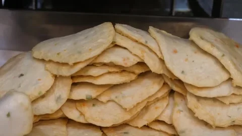 Close-up of Golden Fried Korean Fish Cakes (Eomuk) at a Traditional Street Food Stock Footage 337374593