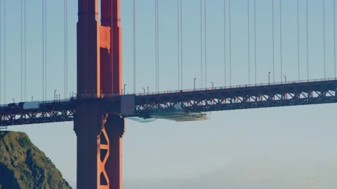 Close on Golden Gate Bridge support and road with renovation work underway Stock Footage 242828815