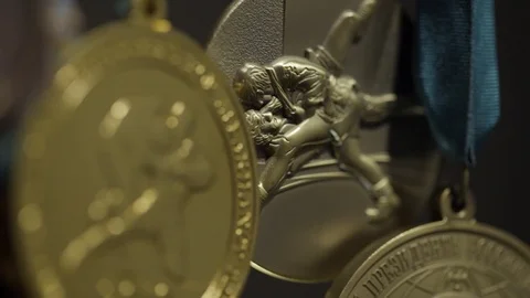 Close up of the golden medals. A rugged gold medal setup majestically against Stock Footage