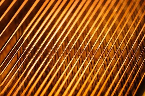 Close-up of Golden Piano Strings Stock Photos