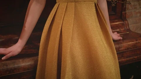 Close-up golden retro style 20s elegant classic vintage luxurious dress on woman Stock Footage 126420580