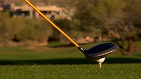 Close up golf ball being hit golf club driver Stock Footage 125277983