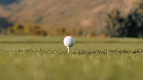 Close up on golf ball being poorly hit with wood club Stock-Footage 102670873