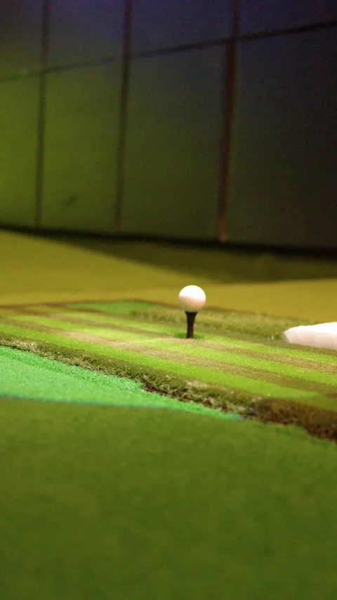 Close Up of Golf Ball Rising on Automatic Tee in Simulator Stock Footage 333306643