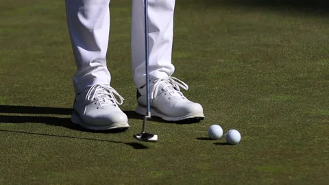 Close Up of Golfer Hitting Ball with Putter - Slow Motion 120P Stock Footage 138790967