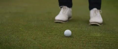 Close Up of Golfer Hitting Ball With Wedge Stock Footage 242379231