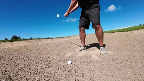 Close up of a golfer hitting a bunker shot Stock Footage 208887844