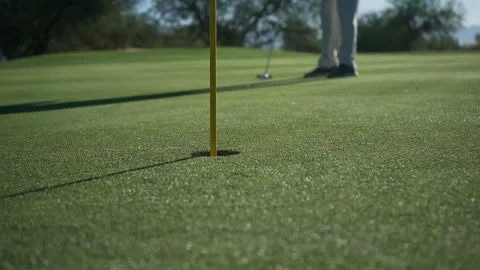 Close up of a golfer making a putt Stock Footage 165277181