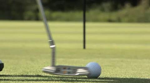 Close-up of golfer putting a golfball Stock Footage 36794700