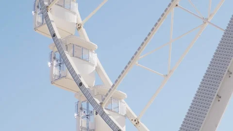 Close-up of gondolas on a moving Ferris wheel Stock Footage 253892234