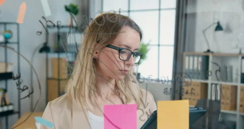 Close up of good-looking confident creative blond woman in glasses which writing Stock Footage 157939144