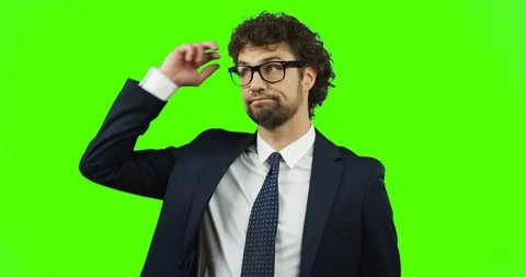 Close up of the good looking man in the glasses, suit and tie standing in front Stock Footage 90729875