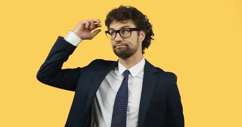 Close up of the good looking man in the glasses, suit and tie standing in front Stock Footage 104263278