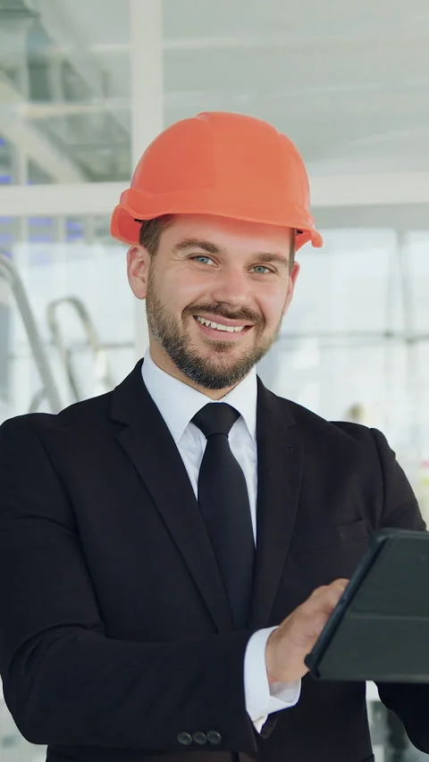 Close up of good-looking positive modern experienced bearded architect or engine Stock Footage 327930376