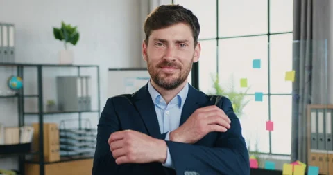 Close up of good-looking smiling confident successful adult bearded businessman Video stock 159714561