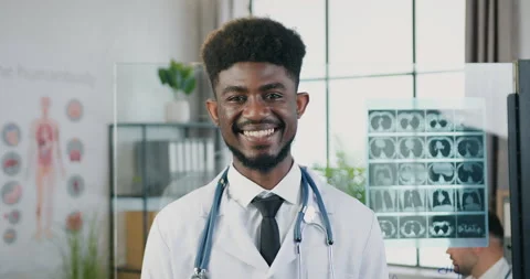 Close up of good-looking smiling smart successful skilled young black-skinned Stock Footage 160415654