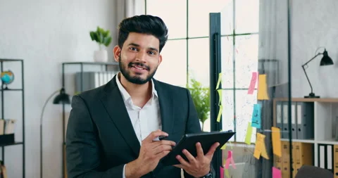 Close up of good-looking smiling successful inventive bearded guy which looking Stock Footage 157989795