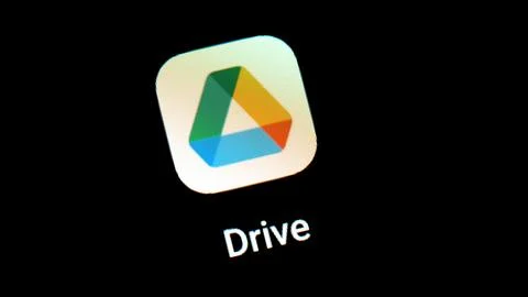 A close-up of the Google Drive app icon on a mobile device smartphone scree.. Foto stock