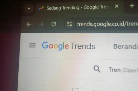 A close up of the Google Trends interface, displaying trending topics in In.. Stock Photos